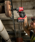 Hard Hitting Brushless Impact Wrench With Friction Ring Unleashes Knockout 1400 Foot Pounds Of Torque For Swift Socket Swaps And Beefy Fastening Tasks Compact 18 Volt Cordless Power Tool Built Like A Tank For Real World Applications in use on a metal flange.