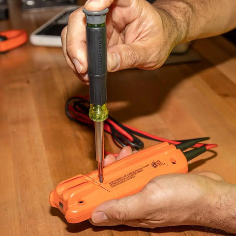 Person using 14-In-1 Electronic Precision Screwdriver Kit With 8 Tips Slotted Phillips And Tamperproof Torx Bits And 6 Nut Drivers Premium Spin Cap for ultra-precise fastening