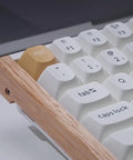Next Level Wireless Gaming Mechanical Keyboard With Compact 96 Layout And Rapid Magnetic Switches Hot Swap Programmable RGB Backlight Bluetooth Wired Setup Fire Performance For Mac Windows keyboard close-up with wooden frame and white keys