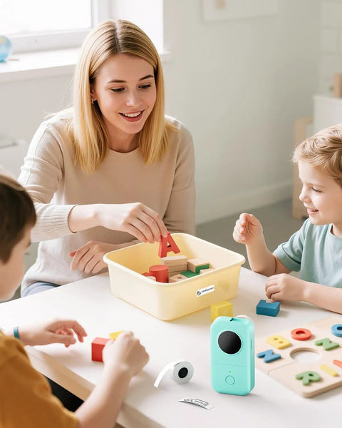 Top Tier Bluetooth Label Maker prints crisp adhesive text instantly while kids play with colorful blocks and letters.