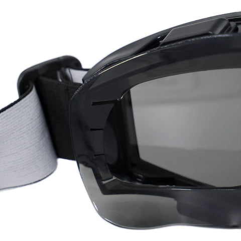 Close-up of Anti Fog Wide Vision Safety Goggles With ANSI Z87 Certification And UV Eye Protection, showing strap and lens detail.