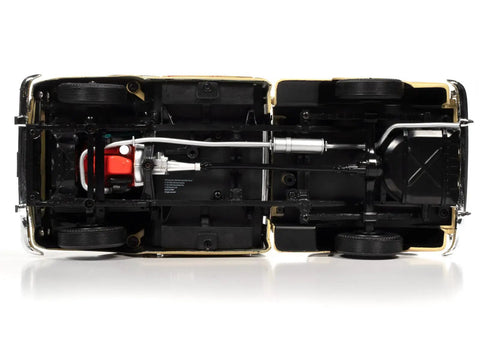 Underside view of 1957 Chevy 3100 Stepside Diecast Pickup 1 18 Scale Black And Tan Model with authentic chassis and wheels.