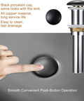 Close-up of pop-up drain mechanism with black porcelain cap and metal body for Matte Black Oval Vessel Sink 23.5 by 15.7 Inches.
