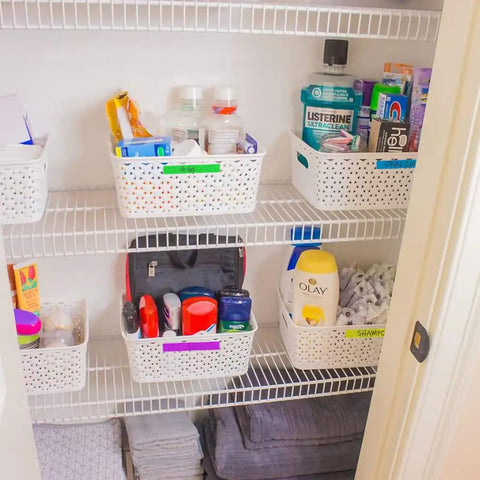 Organized shelf with baskets of toiletries and supplies, ideal for home storage solutions.