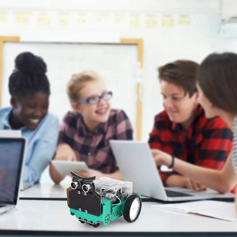 Owl Smart Robot Car Kit For Kids With Nano V4 Controller Arduino Compatible Kid Friendly Hands On Build Code And Bring It To Life With Block Coding Motors Sensors Lights And Sound Ideal For Homeschooling Coding Clubs And Weekend Projects. owl robot car on table with kids coding laptops