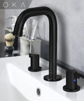 Matte Black Widespread Bathroom Faucet With Two Handles, Three Piece Vanity Lavatory Set shown over white sink
