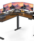 L Shaped Standing Desk 63 By 55 Inches Electric Sit Stand Table With Adjustable Height, Work From Home Friendly, Black setup with monitors