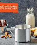 Aluminum Camping Mug With Side Handle Stove Top Safe 0.7 Quart Cup In Silver next to milk and bread, ideal for outdoor beverages