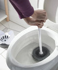 Person using Heavy Duty Toilet Plunger With Hideaway Holder Caddy, The Go-To Bathroom Tool, Compact Design With Non-Skid Rubber Base