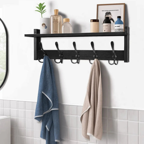 Coat Rack With Shelf And Tri Hooks Wall Mounted 24 Inch Wooden Hanging Coat Hanger For Entryway Bathroom Mudroom And Bedroom Black Finish With Stable Iron Frame For Everyday Use, featuring towels and toiletries.