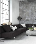 Holden 70 Inch Floor Lamp in Brushed Steel with Inline On Off Foot Switch next to modern black sofa in industrial living room