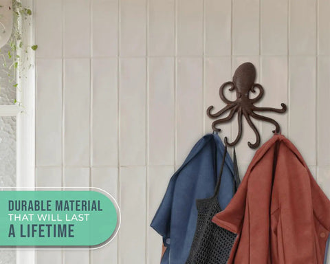 Rad Cast Iron Octopus Wall Hook Rustic Brown Antique Finish holding two towels on a white tiled wall, showcasing sculpted tentacles.