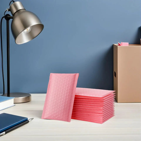 Stack of pink bubble padded mailers self seal envelopes 100 pack for jewelry and makeup supplies waterproof shipping bags