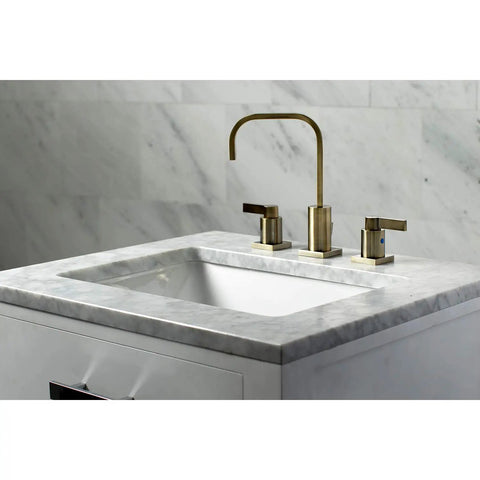 Antique Brass Widespread Bathroom Faucet With Drip Free Ceramic Disc Cartridge Deck Mount Eight To Sixteen Inch Three Hole Installation One Point Two GPM Flow At Sixty Psi One Half Inch IPS Connection Classic Modern Blend on marble sink