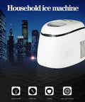 Compact Countertop Ice Maker Slaps Out Crisp Cubes In A Cinch, A sleek white household ice machine on a dark surface.