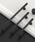 10 Pack Matte Black Kitchen Cabinet Knobs For Cabinets And Drawers, Dope Modern Hardware Upgrade, Easy Install, Durable Pull Handles For Kitchen And Bathroom Renovations. Matte black zinc alloy cabinet pulls and knob on white door.