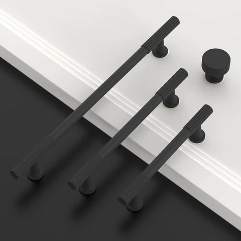 10 Pack Matte Black Kitchen Cabinet Knobs For Cabinets And Drawers, Dope Modern Hardware Upgrade, Easy Install, Durable Pull Handles For Kitchen And Bathroom Renovations. Matte black zinc alloy cabinet pulls and knob on white door.