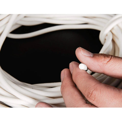 Hand holding Top-Tier Silicone Foam Round Sealing Strip 10M Long, showing flexible cord for heat protection up to 200C.
