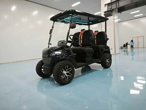 Premium Electric Four Seater Golf Cart With LED Starlight Ceiling And 14 Inch All Terrain Tires in a spacious indoor area.