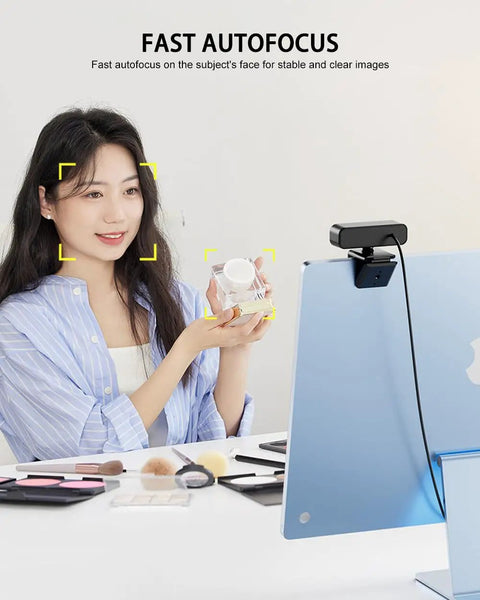 Premium 4K Webcam With Built In Ring Light And Dope Privacy Shutters For Crisp Streaming And Badass Video Calls Featuring Dual AI Noise Canceling Mics Plus Super Fast Autofocus with fast autofocus on user at desk.