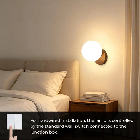Prosmoon Modern Globe Wall Sconce Set of 2, 3-Color Temperature Adjustable mounted beside a bed with a warm glow.