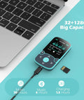 32GB Clip On MP3 Player With Bluetooth 5.3 For Sports, A65 Pedometer Music Player beside laptop, showing charging