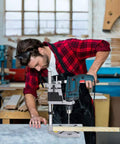 Knock Out Precise Holes Like A Pro With This Bench Drill Press Stand featuring a man drilling into wood on a sturdy base.