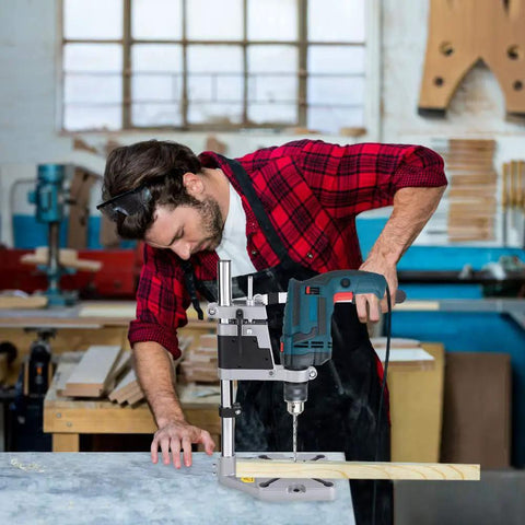 Knock Out Precise Holes Like A Pro With This Bench Drill Press Stand featuring a man drilling into wood on a sturdy base.