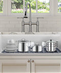29 By 15.35 Inch Silicone Kitchen Sink Mat no fuss heat resistant easy clean gray protector in stainless steel sink with dishes.