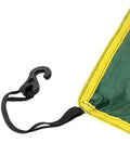 Close-up of Portable Outdoor Survival Head Cover clip with yellow trim and green fabric for camping shelter sunproof and rainproof use.