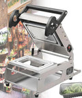 Heavy Duty Commercial Stainless Steel Food Tray Sealer Machine Semi Automatic Manual Packaging Unit With Adjustable Temp Control For Fresh Box Closures at a grocery store.