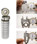 608ZZ Double Shielded Miniature Ball Bearings Set Of Twenty Hardened Steel Axles measuring with calipers for precision.