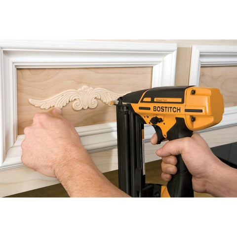 Person using Brad Nailer Kit With Smart Point Technology, 18 Gauge Pneumatic Nailer Delivers 5/8 To 2-1/8 Inch Nails on molding