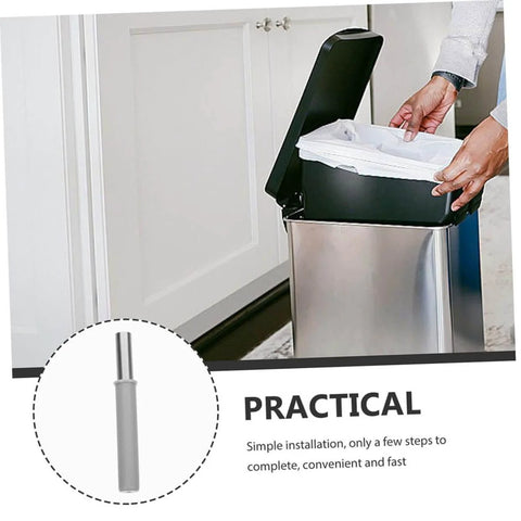 Person installing OKUMEYR Hydraulic Trash Can Dampers 2 Pack For Quiet Soft Close And Noise Reduction on stainless steel bin in kitchen
