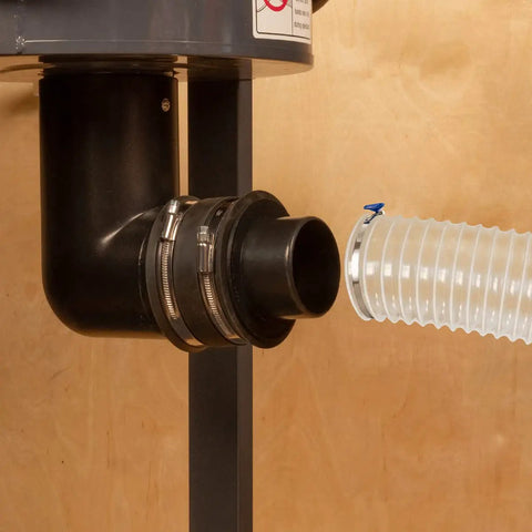 Hella Tough 4 To 3 Inch Dust Collection Reducer Flex Coupler With Steel Hose Clamps connecting to a workshop vacuum hose