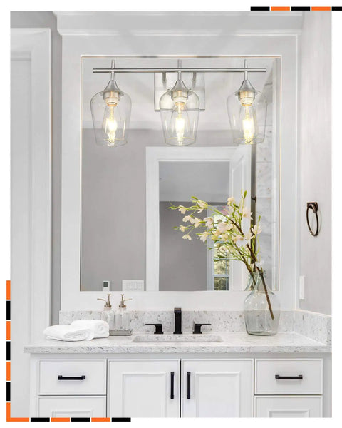Three Light Vanity Light Fixture Over Mirror in Brushed Nickel With Clear Glass Wine Glass Shades in modern bathroom