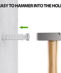 Concrete Wall Anchors For TV Wall Mount Installation Suitable For Concrete Or Brick Walls Durable Plastic Anchor Bolts 10x50mm White 6 Pack With Two Way Expansion For Increased Holding Power being installed with a hammer