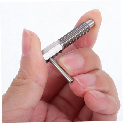 Top Shelf Stainless Steel Retractable Spring Indexing Pin For Cabinets shown in hand, demonstrating spring-loaded mechanism and grip.