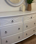 White dresser with Two Pack Black Iron Cabinet Ring Pulls with Screws in a Single Hole Design for kitchen cabinets and furniture.