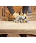 Lightweight 7-1/4 Inch Corded Circular Saw Featuring A Badass 15 Amp Motor With Snappy Electric Brake in use on plywood.