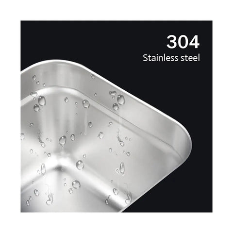 304 stainless steel interior of the digital ultrasonic cleaner bath, showcasing water droplets and smooth finish.
