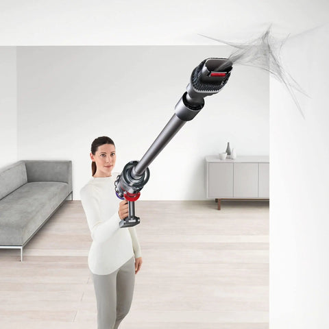 Person using Cyclone V10 Animal Lightweight Cordless Stick Vacuum Cleaner Renewed Purple with Serious Suction in living room.