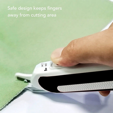 Close-up of Ultra Slick Cordless Electric Scissors for fabric cutting with safety design keeping fingers away from blades.