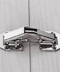 Rock Solid Stainless Steel Cabinet Door Hinge Featuring Drop Dead Smooth Hydraulic Soft Closing 90 Degree Folding Furniture Hardware That Shuts Quietly Without Making A Peep White close-up view on wood surface.