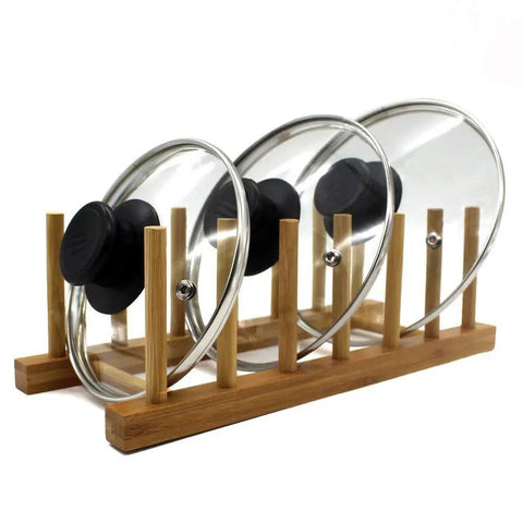 Slick Countertop Space Saver Bamboo Dish Rack And Vertical Plate Lid Organizer holds three glass lids on a bamboo rack.