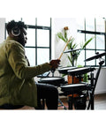Musician playing Electronic V Drums Kit with Floating Hi Hat and Large Cymbal Pads for Realistic Drumming indoors.