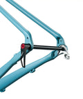 Thru Axle Adapter For Boost Forks, 1.0mm Thread Pitch, visible on the blue bike frame, secured with handle.