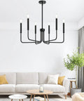 Six Light Farmhouse Industrial Chandelier With Matte Black Finish in modern living room setting