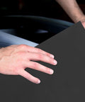 Hand holding Premium Fine Grit Sandpaper Sheets For Precision Sanding On Wood Metal Plastic and Crafts.
