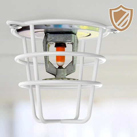 Eight Pack White Fire Sprinkler Head Guard Covers protecting half inch sprinkler with durable white wire frame installation on ceiling.
